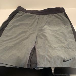 Nike Dri Fit athletic shorts.  Grey with black